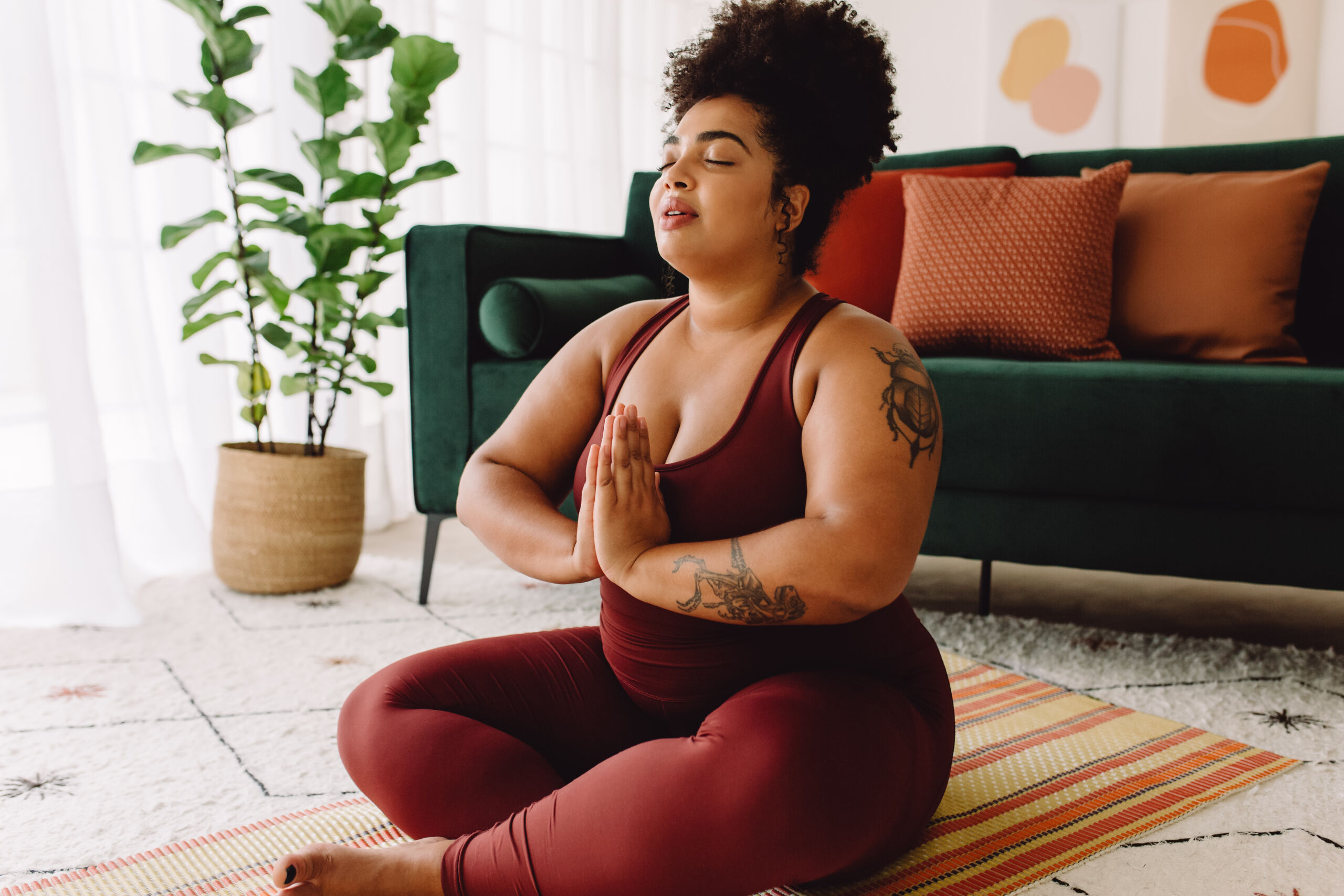 Healthy woman practicing relaxation yoga at home Yoga and Meditation for self care to reduce stress and improve mental health
